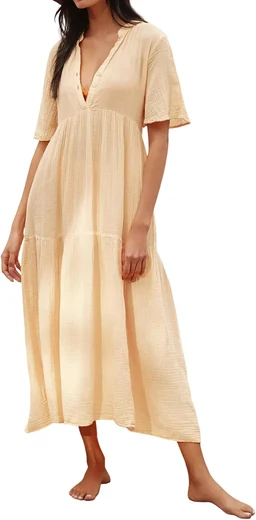 Woman in a cream V-neck half-sleeve flowy tiered cotton maxi dress, product photo